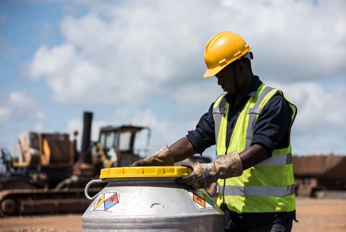 South African worker preparing hazardous garbage for safe collection and disposal